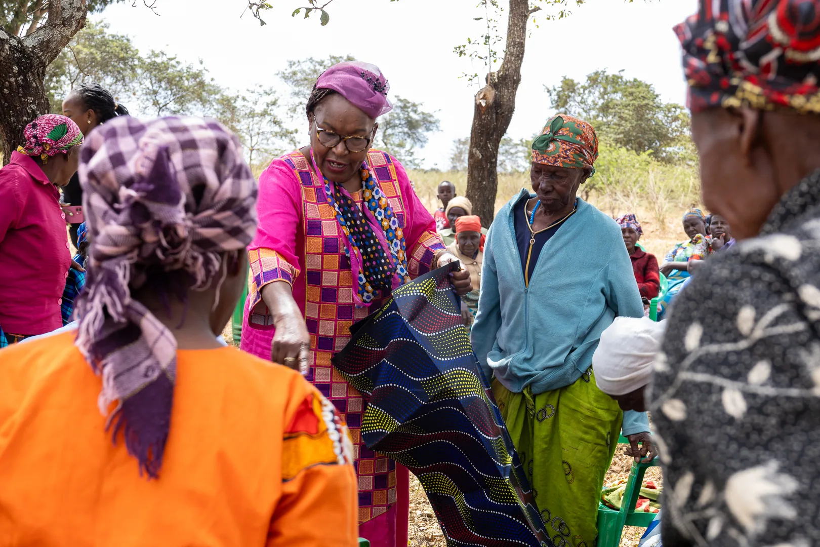 Hon. Nancy Kavinya Kioko sharing supplies with a community member during an outreach visit
